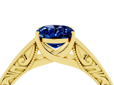 Yellow gold Oval Cut Blue Sapphire Solitaire Ring with Engraved Band and Four-Prong Setting_4