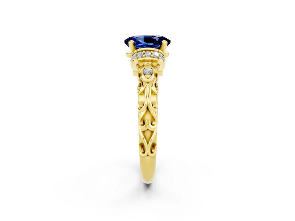 Yellow gold Oval Cut Blue Sapphire Solitaire Ring with Filigree Band and Four-Prong Setting