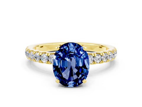 Yellow gold Oval Cut Blue Sapphire Solitaire Ring with Pavé Accents and Four-Prong Setting