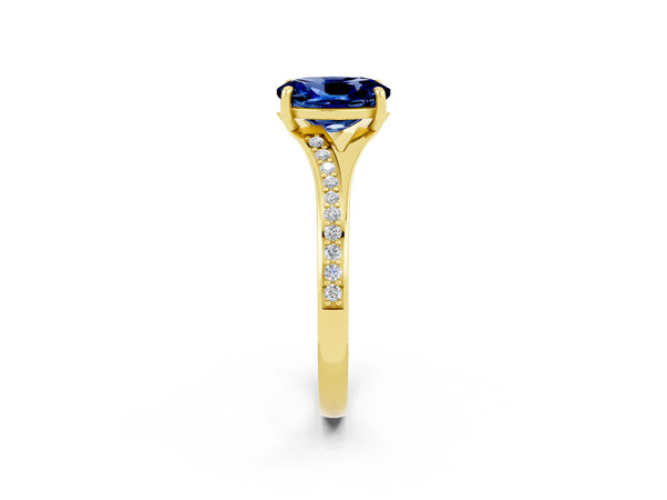 Yellow gold Oval Cut Blue Sapphire Solitaire Ring with Pavé Band and Prong Setting