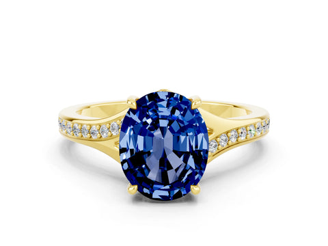 Yellow gold Oval Cut Blue Sapphire Solitaire Ring with Pavé Band and Prong Setting