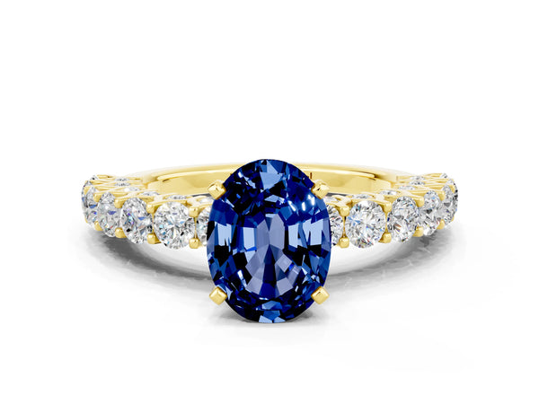 Yellow gold Oval Cut Blue Sapphire Solitaire Ring with Shared Prong Pavé Band and Four-Prong Setting