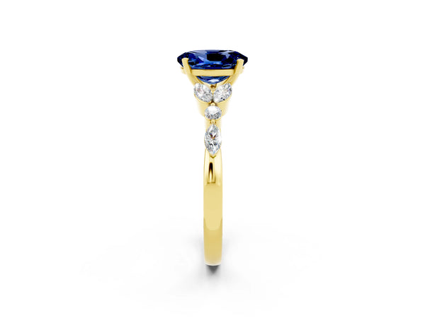 Yellow gold Oval Cut Blue Sapphire Solitaire Ring with Side Stones and Four-Prong Setting