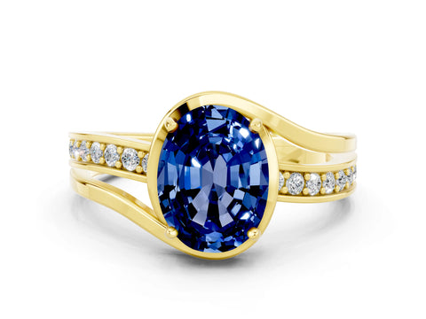 Yellow gold Oval Cut Blue Sapphire Solitaire Ring with Split Shank and Prong Setting