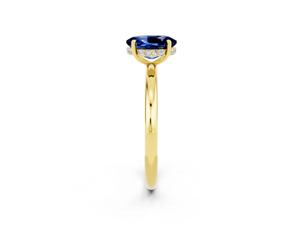 Yellow gold Oval Cut Blue Sapphire Solitaire Ring with Thin Band and Four-Prong Setting