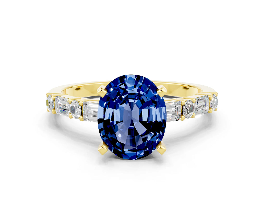 Yellow gold Oval Cut Blue Sapphire Solitaire with Side Baguettes and Channel Set Band