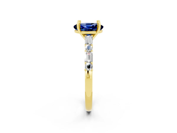 Yellow gold Oval Cut Blue Sapphire Solitaire with Side Baguettes and Channel Set Band