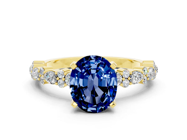 Yellow gold Oval Cut Blue Sapphire Side Stone Solitaire Ring with Round  and Four-Prong Setting