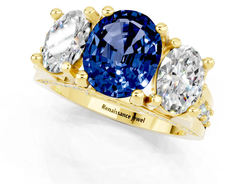 Yellow gold Oval Cut Blue Sapphire Three-Stone Ring with Channel Set Band and Four-Prong Setting_1