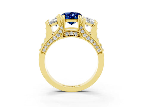 Yellow gold Oval Cut Blue Sapphire Three-Stone Ring with Channel Set Band and Four-Prong Setting_3