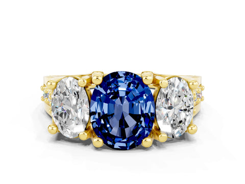 Yellow gold Oval Cut Blue Sapphire Three-Stone Ring with Channel Set Band and Four-Prong Setting