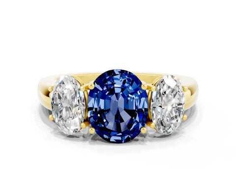 Yellow gold Oval Cut Blue Sapphire Three-Stone Ring with Four-Prong Setting and Classic Band