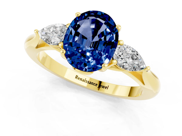 Yellow gold Oval Cut Blue Sapphire Three-Stone Ring with Pear  Side Stones and Prong Setting