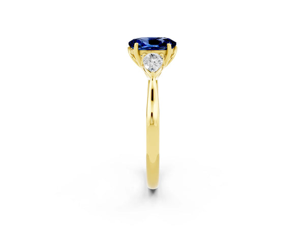Yellow gold Oval Cut Blue Sapphire Three-Stone Ring with Pear  Side Stones and Prong Setting