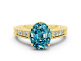 Yellow gold Oval Cut Blue Topaz Engagement Ring with Milgrain Channel Set Band and Prong Setting
