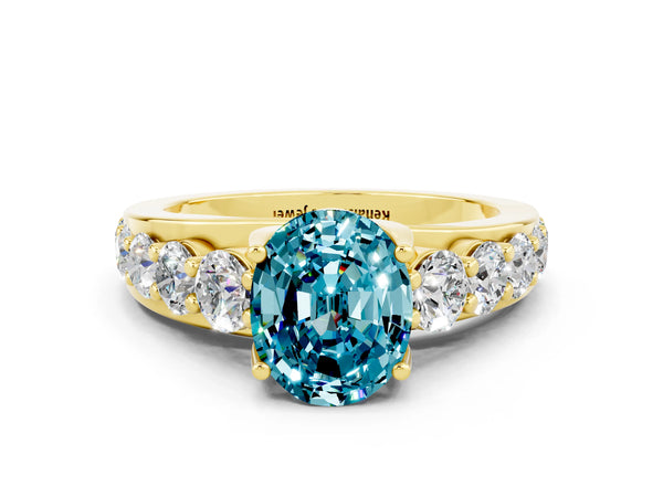 Yellow gold Oval Cut Blue Topaz Engagement Ring with Pavé Band and Four-Prong Setting