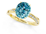 Yellow gold Oval Cut Blue Topaz Engagement Ring with Side Stone Accents and Four-Prong Setting_61
