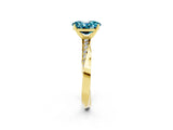 Yellow gold Oval Cut Blue Topaz Engagement Ring with Side Stone Accents and Four-Prong Setting_62