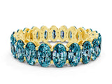Yellow gold Oval Cut Blue Topaz Eternity Band with Shared Prong Setting