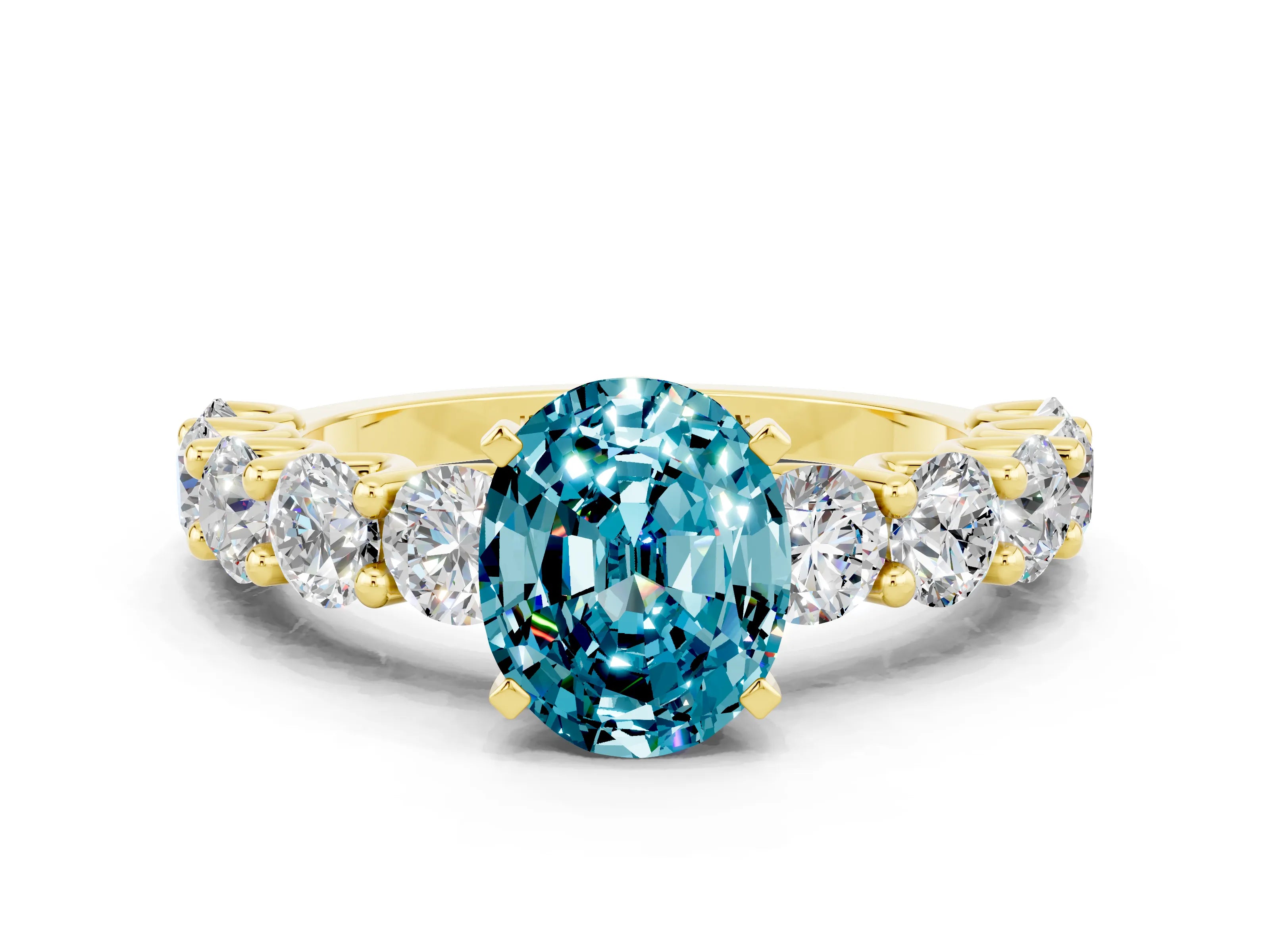 Yellow gold Oval Cut Blue Topaz Prong Setting with Side Stones on a Pave Band