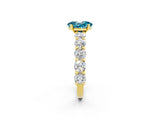 Yellow gold Oval Cut Blue Topaz Prong Setting with Side Stones on a Pave Band_2