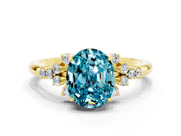 Yellow gold Oval Cut Blue Topaz Ring with Side Stones and Four-Prong Setting