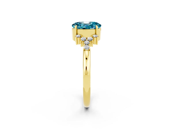 Yellow gold Oval Cut Blue Topaz Ring with Side Stones and Four-Prong Setting