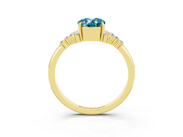 Yellow gold Oval Cut Blue Topaz Ring with Side Stones and Four-Prong Setting