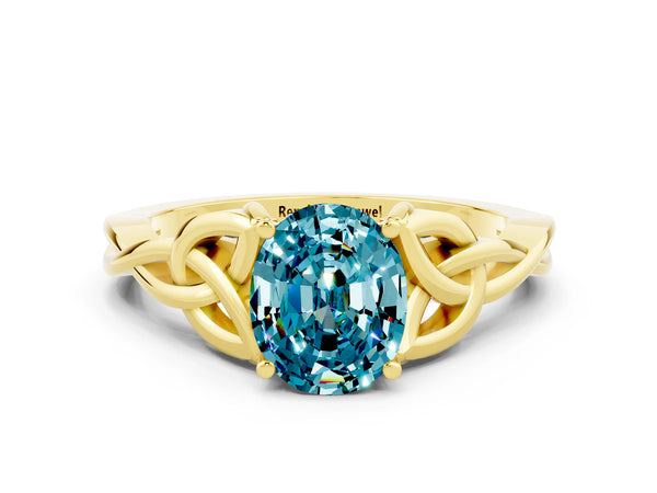 Yellow gold Oval Cut Blue Topaz Solitaire Celtic Knot Ring with Four-Prong Setting