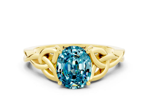 Yellow gold Oval Cut Blue Topaz Solitaire Engagement Ring with Celtic Knot Band and Four-Prong Setting