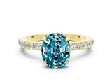 Yellow gold Oval Cut Blue Topaz Solitaire Engagement Ring with Pavé Band and Four-Prong Setting_12
