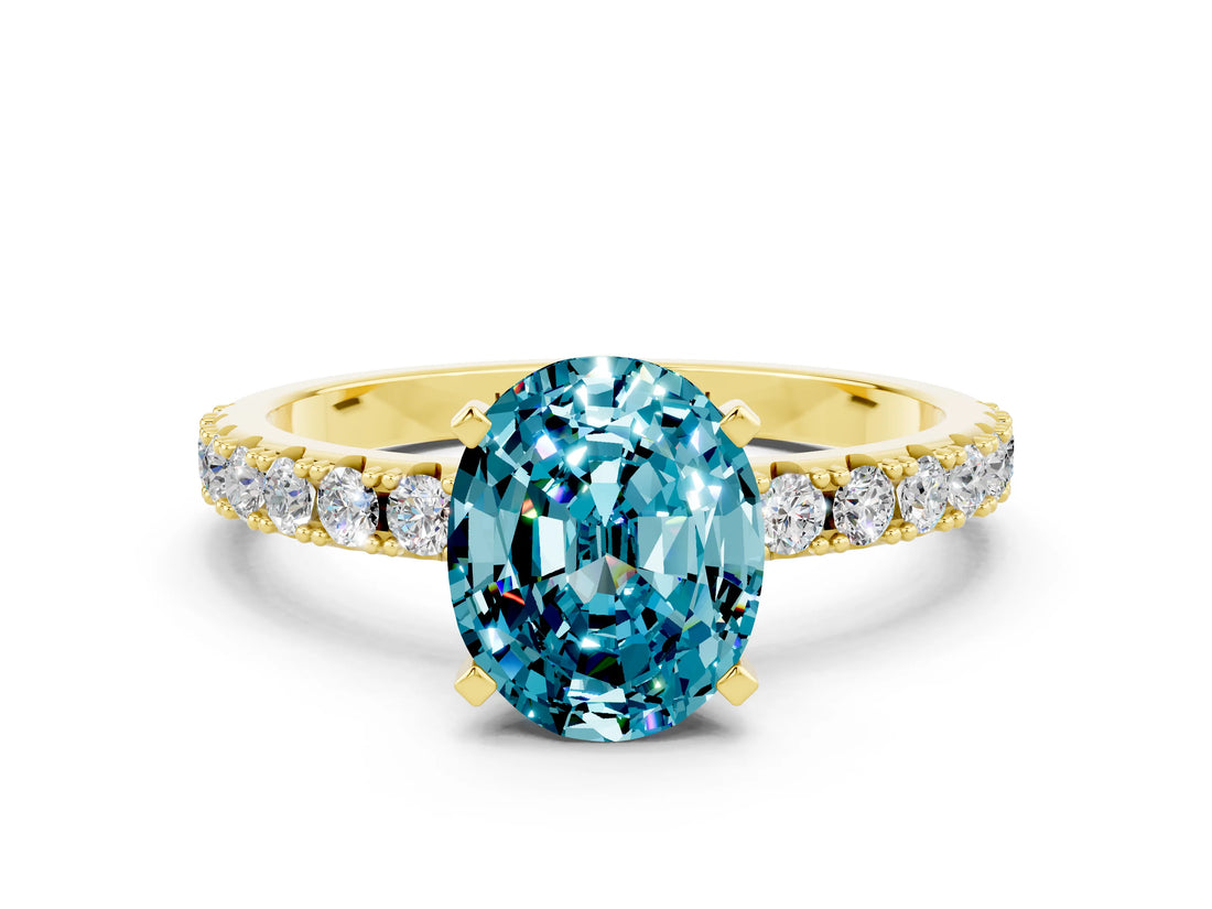 Yellow gold Oval Cut Blue Topaz Solitaire Pavé Band with Four-Prong Setting