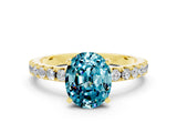 Yellow gold Oval Cut Blue Topaz Solitaire Pavé Band with Four-Prong Setting