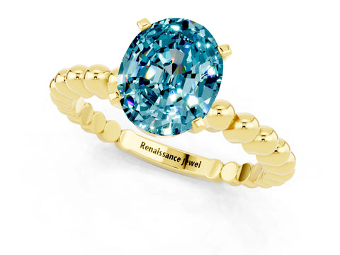 Yellow gold Oval Cut Blue Topaz Solitaire Ring with Beaded Band and Prong Setting_1