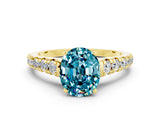 Yellow gold Oval Cut Blue Topaz Solitaire Ring with Cathedral Setting and Pavé Band