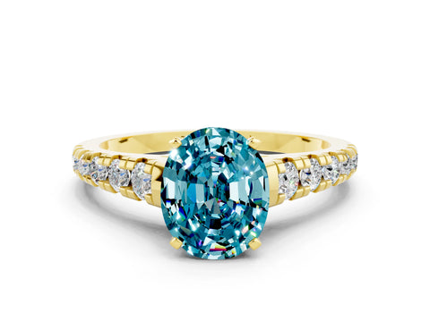 Yellow gold Oval Cut Blue Topaz Solitaire Ring with Cathedral Setting and Pavé Band