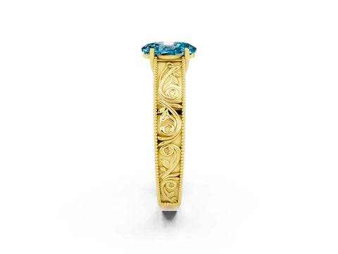 Yellow gold Oval Cut Blue Topaz Solitaire Ring with Engraved Band and Four-Prong Setting_2