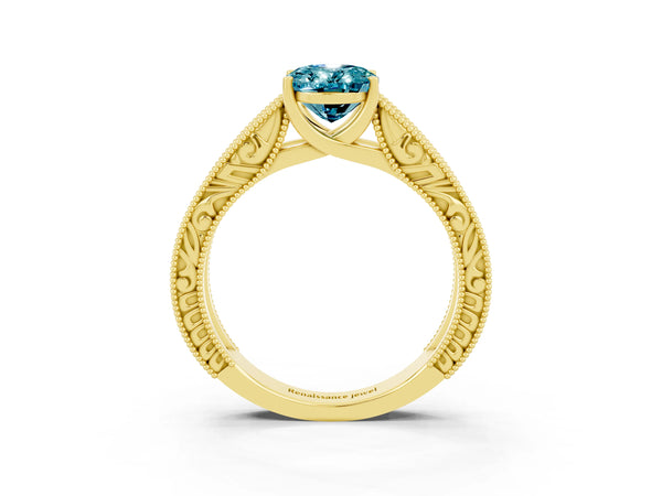Yellow gold Oval Cut Blue Topaz Solitaire Ring with Engraved Band and Four-Prong Setting