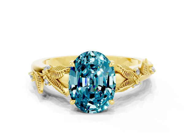 Yellow gold Oval Cut Blue Topaz Solitaire Ring with Leaf Motif Band and Four-Prong Setting