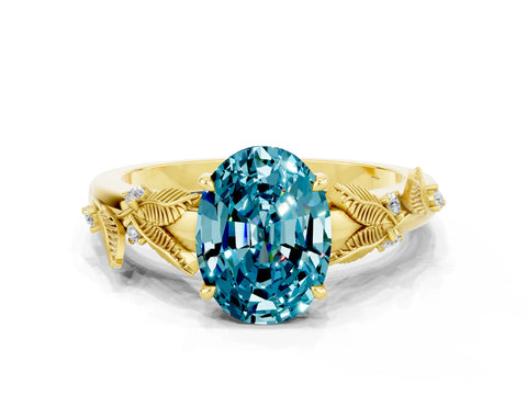 Yellow gold Oval Cut Blue Topaz Solitaire Ring with Leaf Motif Band and Four-Prong Setting