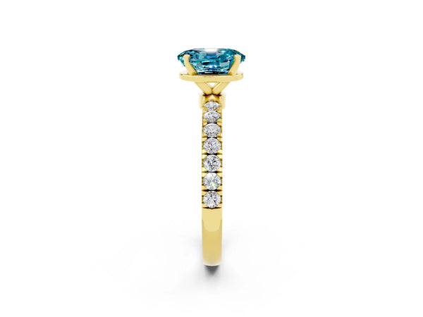 Yellow gold Oval Cut Blue Topaz Solitaire Ring with Pavé Accents and Four-Prong Setting