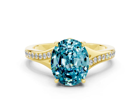 Yellow gold Oval Cut Blue Topaz Solitaire Ring with Pavé Band and Prong Setting