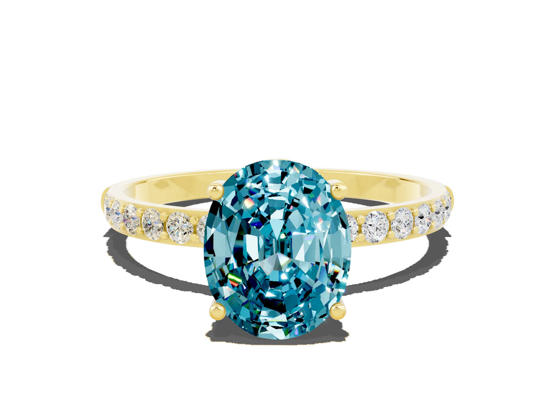 Yellow gold Oval Cut Blue Topaz Solitaire Ring with Pave Band and Four Prong Setting