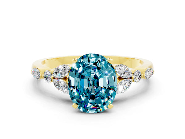 Yellow gold Oval Cut Blue Topaz Solitaire Ring with Side Stones and Four-Prong Setting