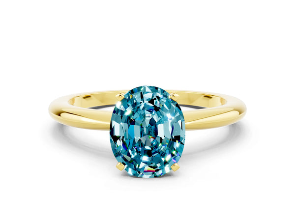 Yellow gold Oval Cut Blue Topaz Solitaire Ring with Six-Prong Setting and Classic Band