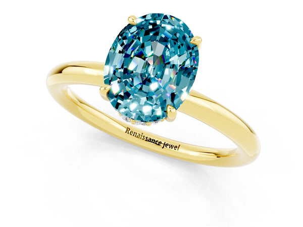 Yellow gold Oval Cut Blue Topaz Solitaire Ring with Thin Band and Four-Prong Setting