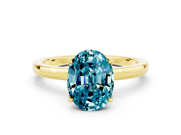 Yellow gold Oval Cut Blue Topaz Solitaire Ring with Thin Band and Prong Setting