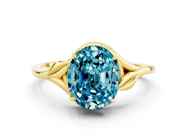 Yellow gold Oval Cut Blue Topaz Solitaire Ring with Twist Band and Four-Prong Setting