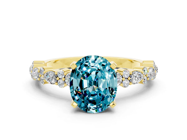 Yellow gold Oval Cut Blue Topaz Side Stone Solitaire Ring with Round  and Four-Prong Setting