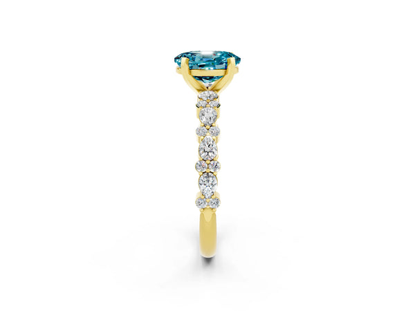 Yellow gold Oval Cut Blue Topaz Side Stone Solitaire Ring with Round  and Four-Prong Setting
